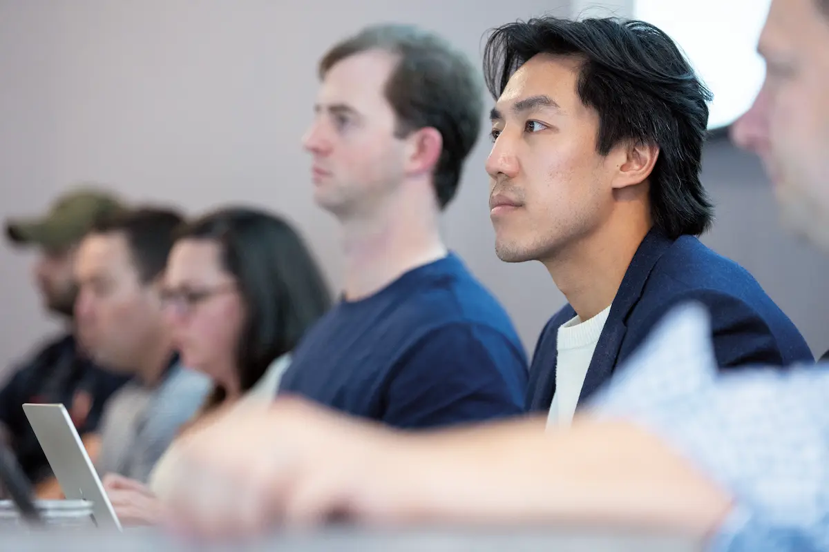A row of students in a classroom