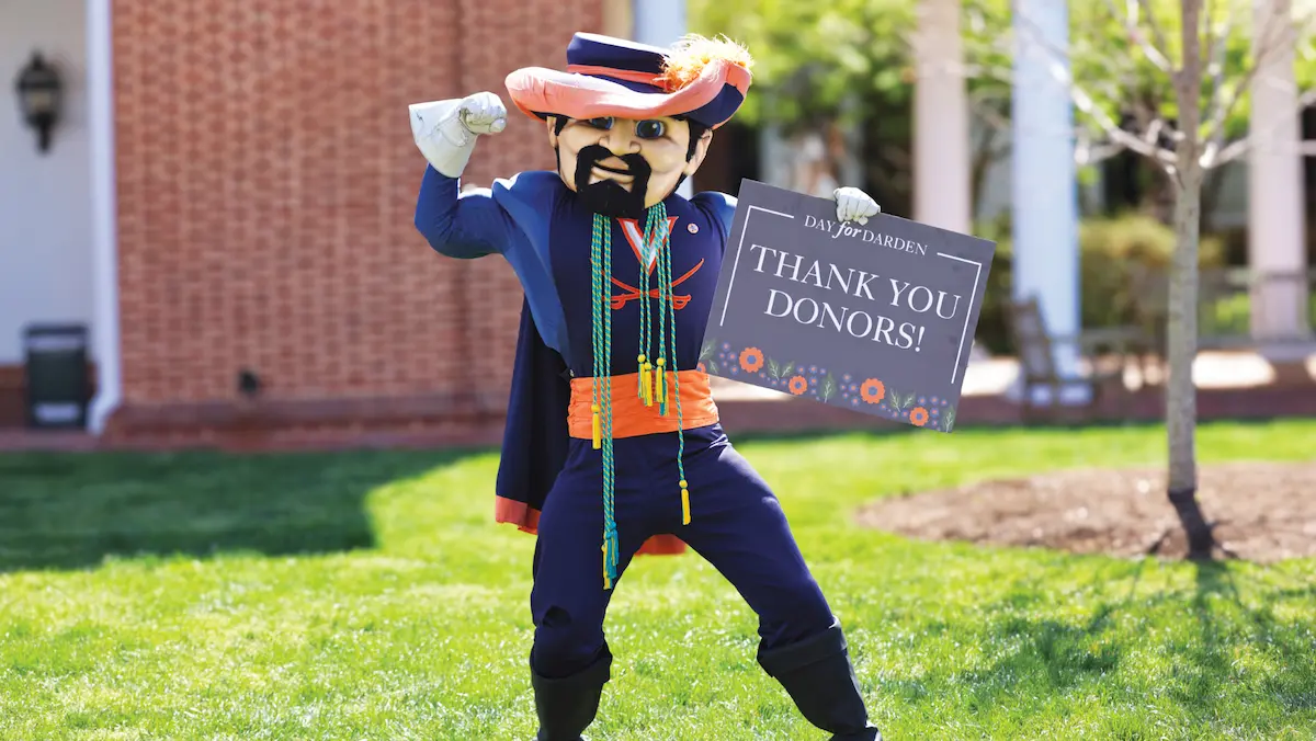 Cav Man holding a sign saying 'Thank You Donors!'