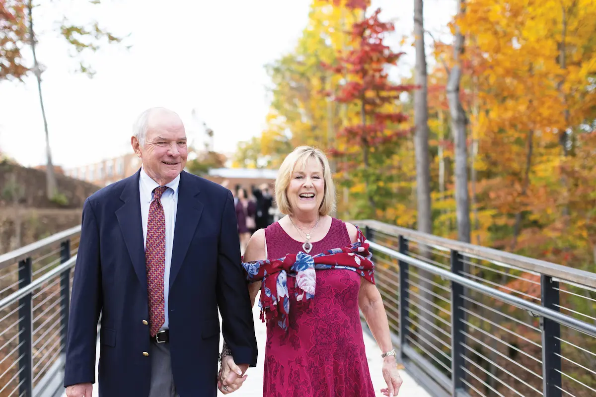 Two people walking at the LaCross Botanical Gardens dedication